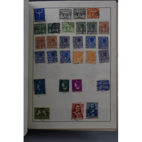 499 - Movaleaf Worldwide Stamp Album Containing a Large Selection of Great Britian, Hong Kong, Indian and ... 