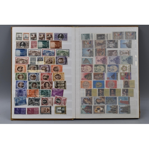 503 - Album containing a selection of worldwide stamps including Vatican, Austria, Spain, Belgium, Monaco,... 