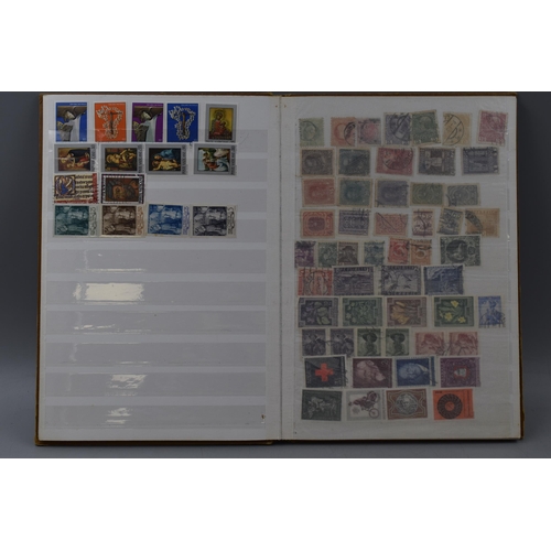 503 - Album containing a selection of worldwide stamps including Vatican, Austria, Spain, Belgium, Monaco,... 