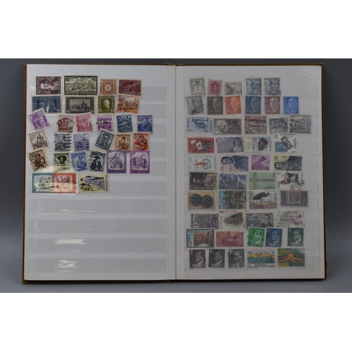 503 - Album containing a selection of worldwide stamps including Vatican, Austria, Spain, Belgium, Monaco,... 