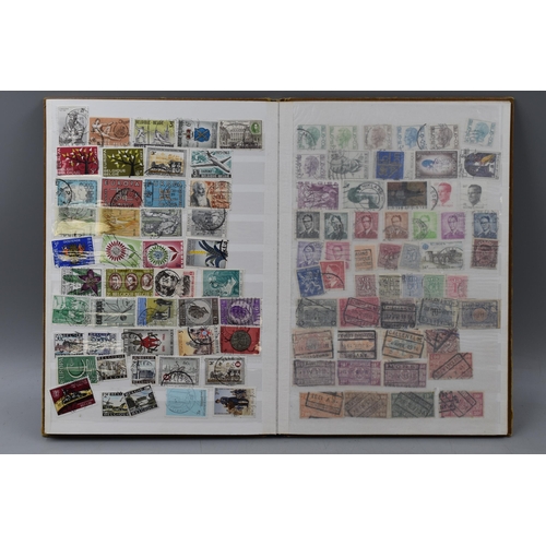 503 - Album containing a selection of worldwide stamps including Vatican, Austria, Spain, Belgium, Monaco,... 