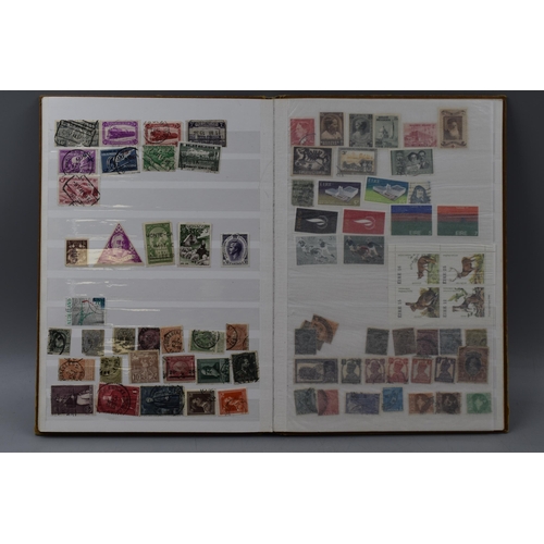 503 - Album containing a selection of worldwide stamps including Vatican, Austria, Spain, Belgium, Monaco,... 