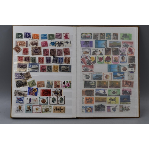 503 - Album containing a selection of worldwide stamps including Vatican, Austria, Spain, Belgium, Monaco,... 