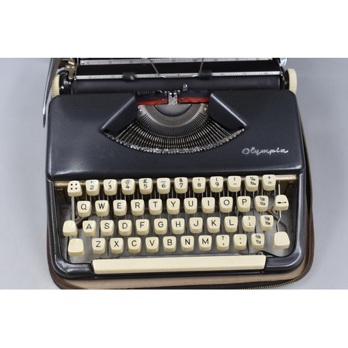 515 - Vintage West German Olympia Typewriter in original case complete with Ribon