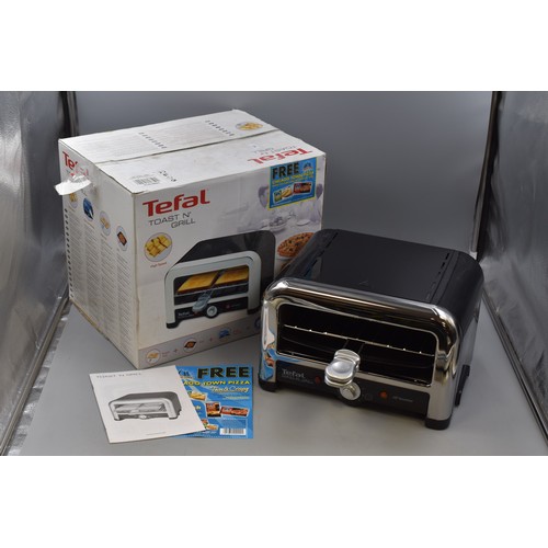 586 - A Tefal Toast n Grill, In Original Box. Powers on When Tested.