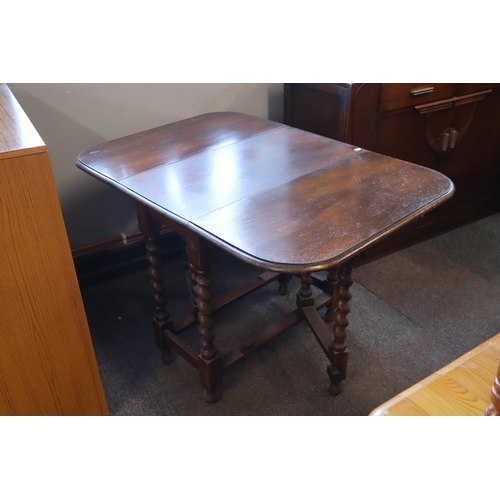 633 - Antique Oak Dropleaf Table sitting on Hand carved Barley Twist Legs Extended 44