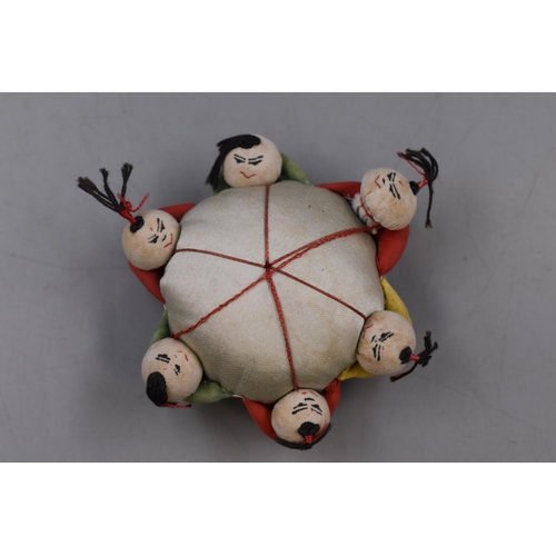 194 - A Vintage Chinese Silk Six Boy Pin Cushion.