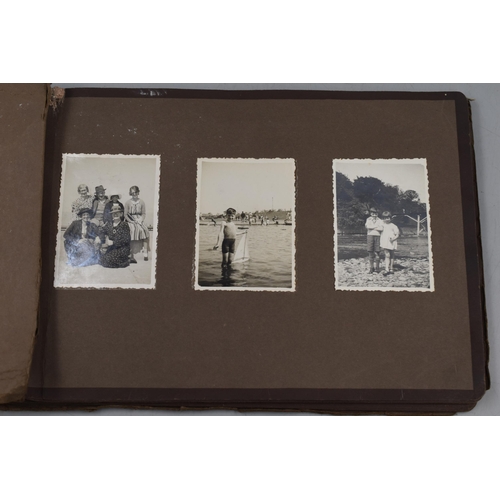 446 - A Photograph Album Containing A Selection of Vintage Photgraphs.