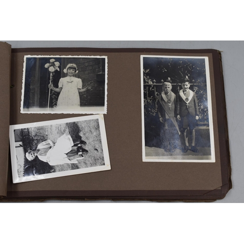 446 - A Photograph Album Containing A Selection of Vintage Photgraphs.