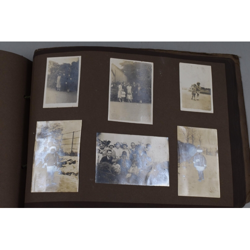 446 - A Photograph Album Containing A Selection of Vintage Photgraphs.