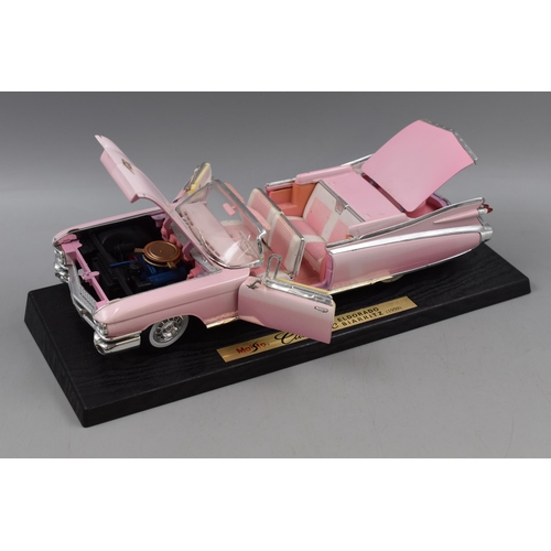 550 - Two Die Cast Vehicles; A Maisto Pink Cadillac Eldorado Bairritz (1:12), And Bburago Porsche Carrera ... 