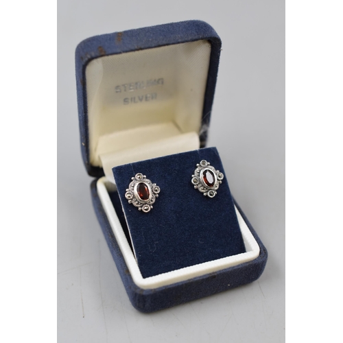 273 - Pair of Sterling Silver Red Stoned Earrings Complete with Presentation Box