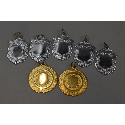 235 - Seven Fobs, Five Silver Tone and Two Gold Tone.