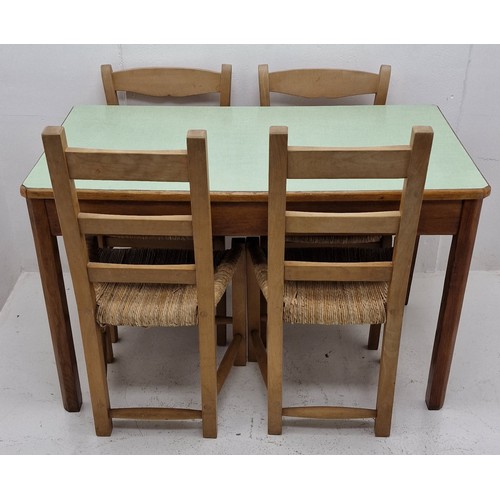 575 - Formica Topped Dining Table 69 x 122cm Approx and 4 Rush Seated Chairs. Wobbly Leg