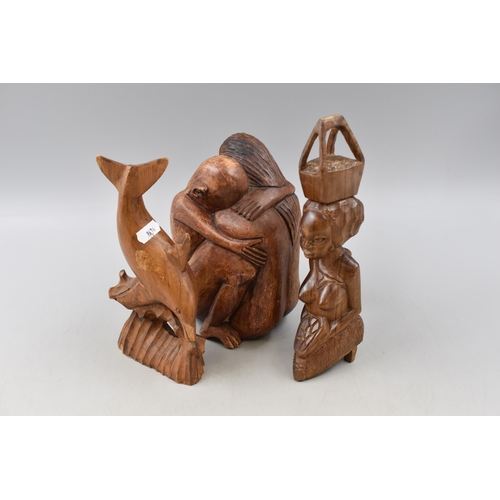 273 - Three Hand Carved Wooden Sculptures, Includes Dolphin, Ethnic Female Figure, And Embracing.