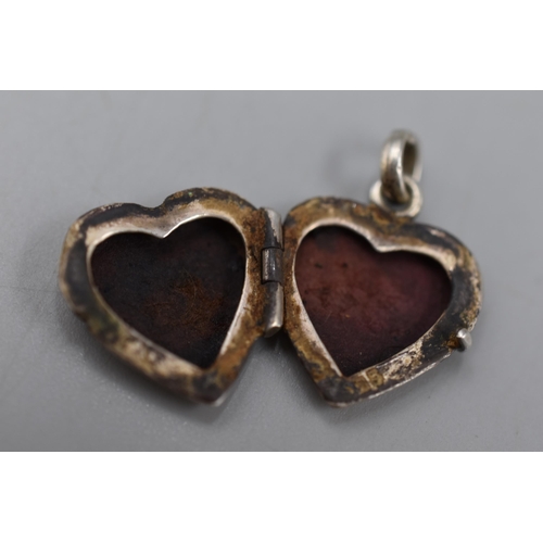 33 - Two Hallmarked Silver Locket Pendants.