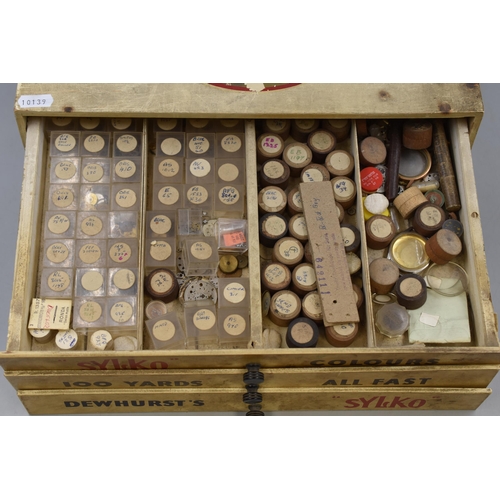 398 - Dewhurst's Sylko Cotton 3 Drawer Cabinet containing a large selection of Watch spares (14