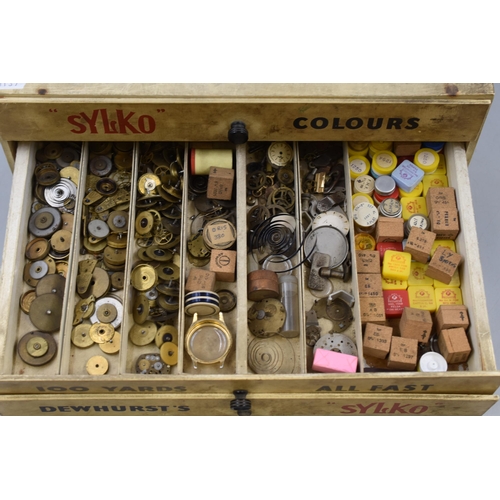 398 - Dewhurst's Sylko Cotton 3 Drawer Cabinet containing a large selection of Watch spares (14