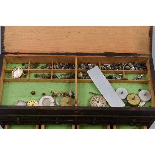 399 - Miniature 12 Drawer Wooden Storage Cabinet Containing a Selection of Watch Parts