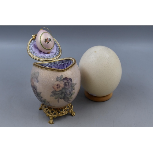 106 - Two Hand Painted Ostrich Eggs one in the style of Faberge wit smaller egg inside