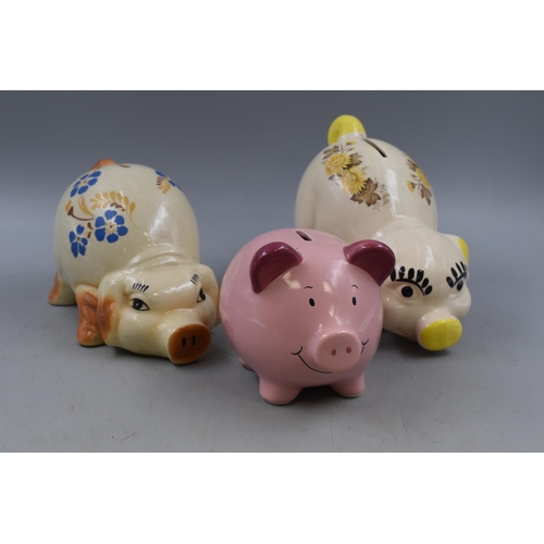 126 - Three Ceramic Piggy Banks With Stoppers