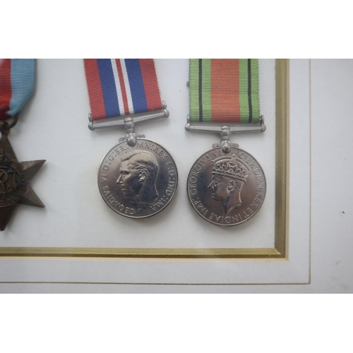 157 - Framed and Glazed Selection of Medals to include the Africa Star, 1939-1945 Star, WWII Defence Medal... 