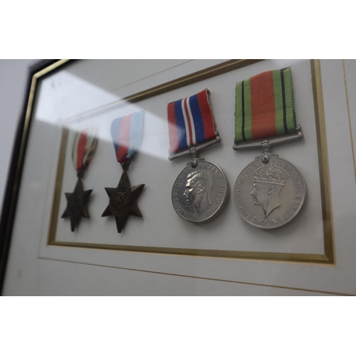 157 - Framed and Glazed Selection of Medals to include the Africa Star, 1939-1945 Star, WWII Defence Medal... 