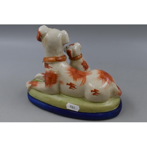 225 - Late 19th Staffordshire King Charles Spaniel and Pup Figural Group (20cm)