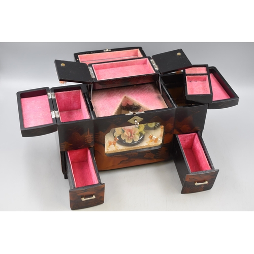 235 - Oriental Laquered Musical Jewellery box (34cm x 19cm x 14cm)