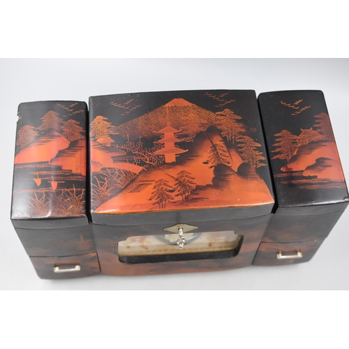 235 - Oriental Laquered Musical Jewellery box (34cm x 19cm x 14cm)