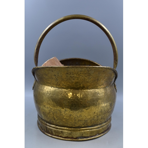 298 - A Large Hammered Brass Effect Coal Scuttle, With Wood Logs.