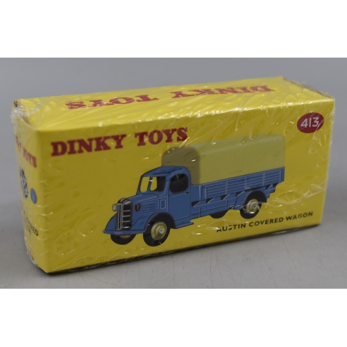 317 - Three Boxed Dinky Die Cast Vehicles. Includes Austin Covered Wagon, Triumph TR2 Sports and other.