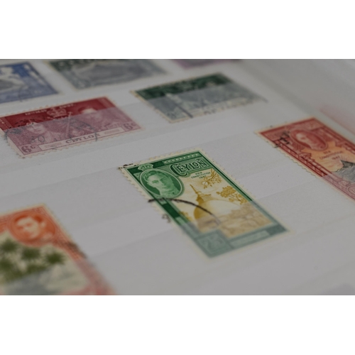 341 - Four Paragon Wessex Stamp Albums Containing a Selection of Worldwide Stamps.