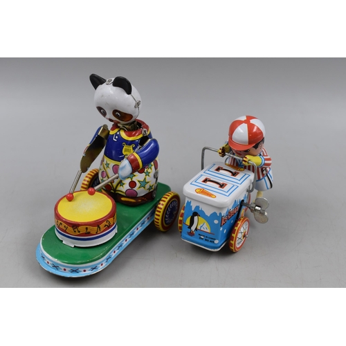 394 - Two Boxed Retro Tin Plate Toys to include Ice Cream Cart and Drumming Panda (one with key).