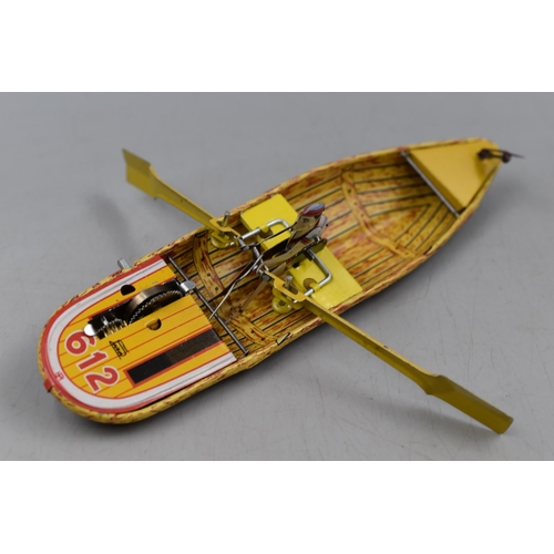 397 - Retro Tin Plate Wind Up Row Boat in Box with Key. By Faya 1905.