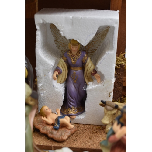 438 - Christmas 11 Piece Porcelain Decorative Nativity Scene. Approx. 18” x 11”.