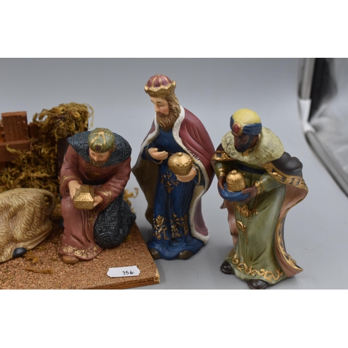 438 - Christmas 11 Piece Porcelain Decorative Nativity Scene. Approx. 18” x 11”.