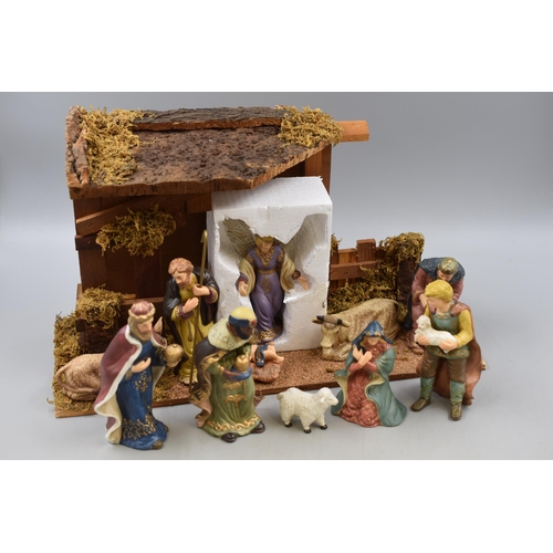 438 - Christmas 11 Piece Porcelain Decorative Nativity Scene. Approx. 18” x 11”.