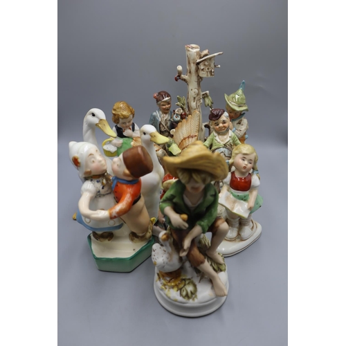 61 - Selection of 12  ceramic Figurines