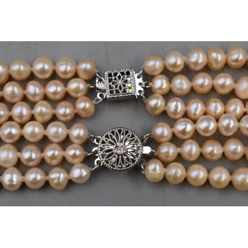 29 - Two Three Strand Pearl necklaces Complete with one display case