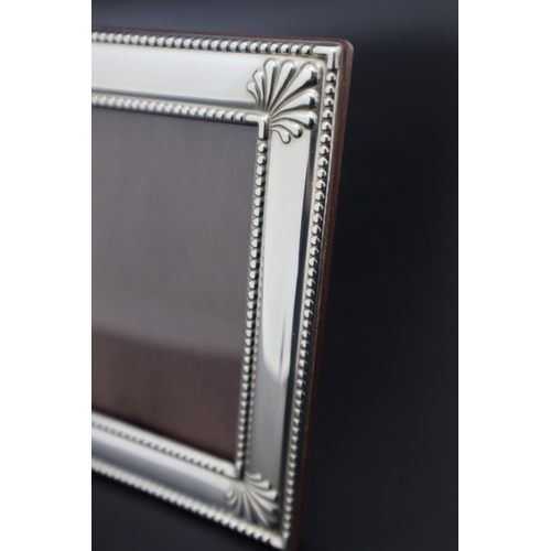 32 - A Hallmarked Sheffield Silver Photo Frame, Circa 1995. Approx 13cm x 10.5cm.