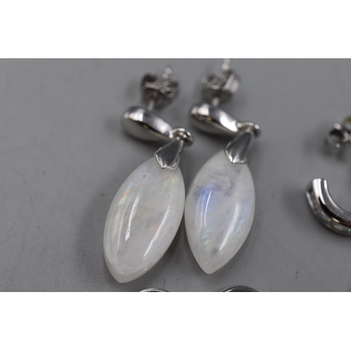 67 - Four Pairs 925 Silver Drop Earrings. Includes Natural Stone Oval Shaped Earrings, Two Pairs of Clear... 