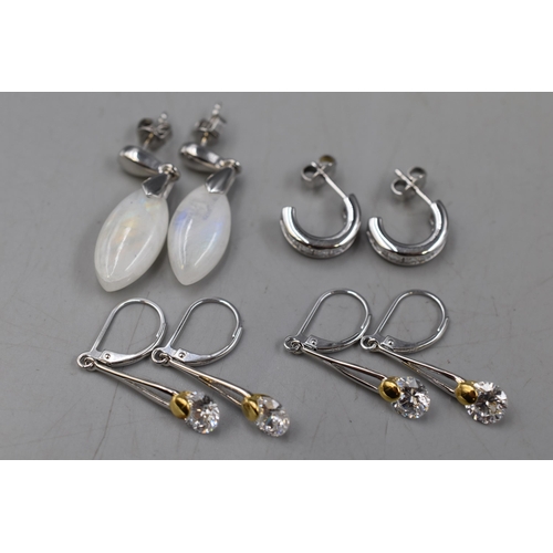 67 - Four Pairs 925 Silver Drop Earrings. Includes Natural Stone Oval Shaped Earrings, Two Pairs of Clear... 