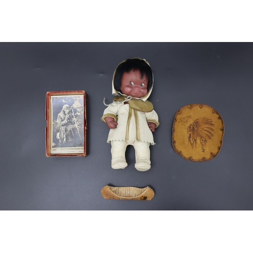 338 - Regal of Canada Eskimo Doll in Leather Outfit with Simcoe Canoe, Mat and Vintage Photographs