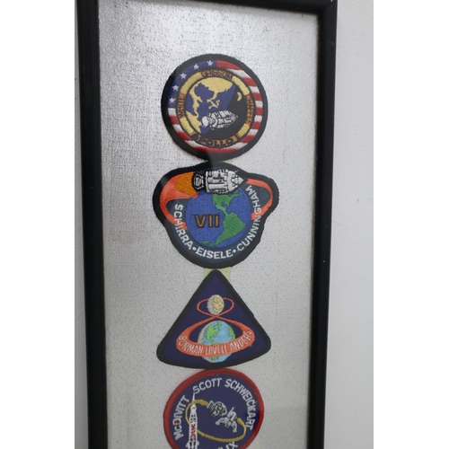 379 - A Framed and Glazed Selection of Twelve Apollo Patches.