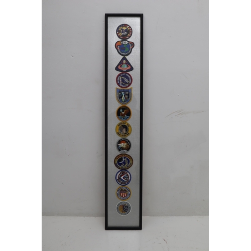 379 - A Framed and Glazed Selection of Twelve Apollo Patches.