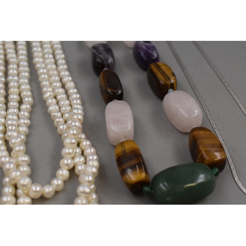 146 - Selection of Five Necklaces (Four are 925 Silver) to include Two Natural Stoned, One Pearl Necklace ... 