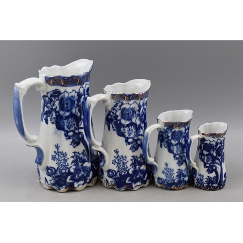 273 - Four Blue and White Graduating Gold Rimmed Jugs, With Swan Mark To Base. Tallest Approx 8