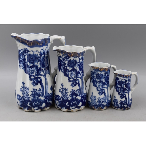 273 - Four Blue and White Graduating Gold Rimmed Jugs, With Swan Mark To Base. Tallest Approx 8