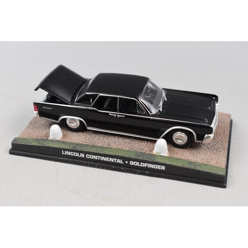 551 - Three Boxed Die Cast Cars to include Rare Morris Minor Campervan and Two James Bond Model Cars, Jagu... 